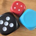 PU foam dice with debossed dots in black, red and blue