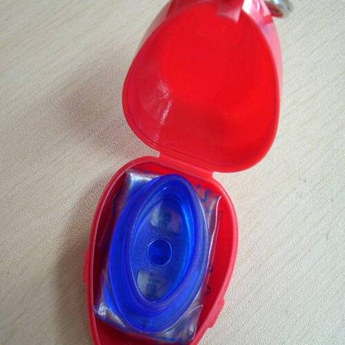 Custom print heartshape plastic box with CPR face shield CPR face shield in heart-shaped plastic box with custom print image
